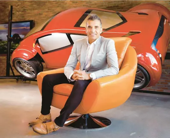  ?? TOM FOX/THE DALLAS MORNING NEWS ?? Toyota Connected’s CEO and President Steve Basra sits in front of a futuristic Lexus used in the movie “Minority Report” on Sept. 20 in Plano, Texas.