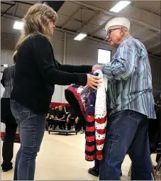  ??  ?? Where the Eagles Soar Quilting presented World War II Navy veteran William “Vern” Walton with a hand-crafter patriotic quilt during the ceremony.