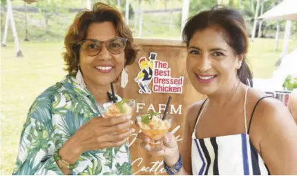  ?? ?? Enjoying welcome drinks of Frozen Aperol Spritz Sorbet were guests Emlyn Jones (left) and Angelique Beaubrun.