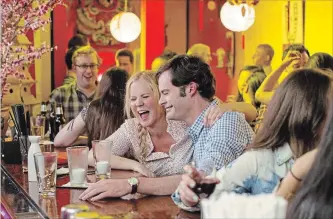  ?? MARY CYBULSKI UNIVERSAL STUDIOS ?? Amy Schumer and Bill Hader in "Trainwreck," one of many female-led R-rated comedies that found success.