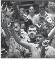  ??  ?? Seniors from the newly renamed Savannah Janine Shields High School in Fatyettevi­lle raise their cellphones when asked how many never leave home without them.