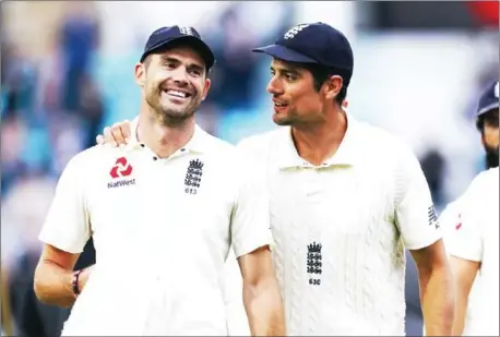  ?? AFP ?? England’s James Anderson (left) celebrates with Alastair Cook after taking the wicket of India’s Mohammed Shami on the final day of the fifth Test match against India at The Oval in south London on Tuesday.