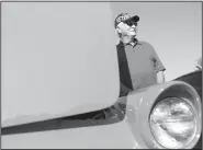  ?? NWA Democrat-Gazette/CHARLIE KAIJO ?? Bill Price of Elkins takes a picture Saturday next to a 1956 Ford Thunderbir­d at the Arvest Ballpark in Springdale. “I just love these old cars,” he said. “I had a ’57 Pontiac super cheap in high school. I loved that thing. These ’50s and ’60s cars are...