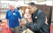  ?? PHOTO BY DAVID CRANE ?? Gubernator­ial recall candidate Larry Elder gets a hug from Jean Woodward at Philippe the Original in L.A. Monday.