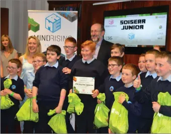  ??  ?? Resource teacher Sinead Herlihy, (second from left) and fourth, fifth and sixth class students from Mitchelsto­wn CBS primary, Co Cork, are presented with their prize for winning the MindRising Games junior category at an awards ceremony in Dublin City...