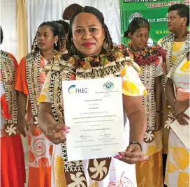  ?? ?? Luisa Qiolevu with her certificat­e in Fashion, Manufactur­ing and Design after graduating from the Makoi Women Vocational Centre.