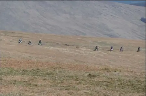  ??  ?? Quad bikers illegally racing through the Wicklow Mountains.