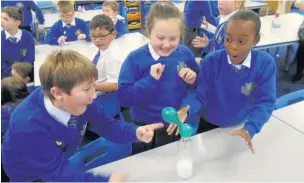  ??  ?? ●●Youngsters carry out a balloon experiment