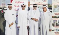  ??  ?? Kuwaiti farmer Nasser Al-Azmi (second from left) with officials.