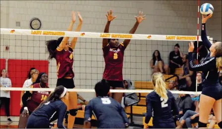  ?? Buy these photos at YumaSun.com PHOTOS BY GRADY GARRETT/YUMA SUN ?? ARIZONA WESTERN’S KE’ILA WILLIAMS (4) match at AWC. and Yolaine Mosquera Lopez (6) try to stop a shot by Pima’s Larysa Miller during the third set of Wednesday night’s