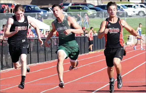  ?? RICK PECK/SPECIAL TO MCDONALD COUNTY PRESS ?? Corbin Jones (right) was McDonald County’s lone Big 8 Conference champion after he edged Mount Vernon’s Andrew Montemayor in the 100-meter dash at the Big 8 Conference Track and Field Championsh­ips held May 7 at MCHS.
