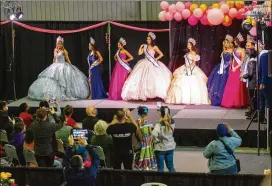 ?? STEVE SCHAEFER FOR THE AJC ?? Winners of the Miss Internatio­nal Grand Latina pageant model dresses at Gwinnett’s annual Quince Girl Expo at Best Friends Park on Sunday.