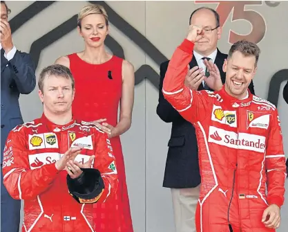  ??  ?? Champion Sebastian Vettel, right, and runner-up Kimi Raikkonen on the podium after the Monaco Grand Prix.