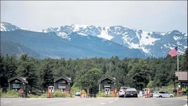  ?? Chet Strange / Special to The Denver Post ?? The entrance to Rocky Mountain National Park on May 30. Starting on June 4, visiting the park required a permit.