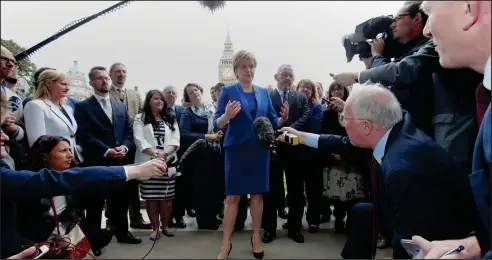  ??  ?? First Miniser Nicola Sturgeon spoke to reporters as the SNP’s new parliament­ary group met at Westminste­r in London