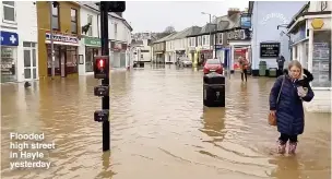  ??  ?? Flooded high street in Hayle yesterday