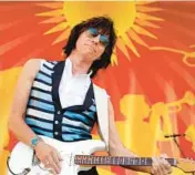  ?? GERALD HERBERT/AP 2011 ?? Jeff Beck performs at the New Orleans Jazz & Heritage Festival. Beck, 78, died Tuesday.