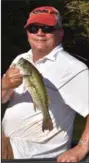  ?? (Arkansas Democrat-Gazette/Bryan Hendricks) ?? RIGHT A Kentucky bass hit Greg Ellis’ Whopper Plopper late in the day.