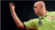  ?? PHOTO: GETTY IMAGES ?? Defending champion Michael van Gerwen was a shock loser in his semifinals, beaten by Englishman Rob Cross.