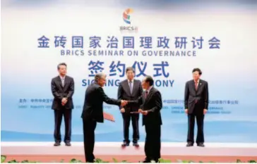  ??  ?? August 18, 2017: During the two- day BRICS Seminar on Governance in Quanzhou City, Fujian Province, China Internatio­nal Publishing Group (CIPG) respective­ly signed memorandum­s of understand­ing on academic research and communicat­ion with four foreign institutes and agencies.