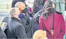  ?? Washington Post photo by Jonathan Newton — ?? Former presidents George Bush and Barack Obama, along with former first lady Michelle Obama gather before Biden was sworn in Washington.