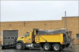  ?? NICHOLAS BUONANNO -MEDIANEWS GROUP FILE ?? Plow trucks in Rensselaer County get filled with sand last year to help treat any slippery roads.