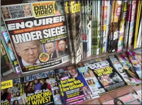  ?? MARY ALTAFFER — ASSOCIATED PRESS FILE ?? In this July 12, 2017, photo, an issue of the National Enquirer featuring President Donald Trump on its cover is displayed on a newsstand in a store in New York.