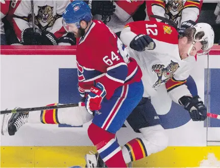  ?? A L L E N MC I N N I S / MO N T R E A L G A Z E T T E ?? Montreal defenceman Greg Pateryn drives Florida Panthers’ Jimmy Hayes into the boards Saturday at the Bell Centre. The hit gave Montreal a spark. “There were a lot of emotions in the first with that huge hit from ( Pateryn),” said teammate Lars Eller.