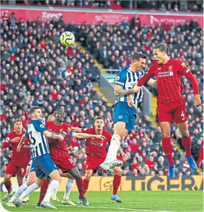  ??  ?? Liverpool captain Virgil van Dijk rise to power home his second goal of the game