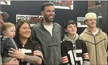  ?? JEFF SCHUDEL — THE NEWS-HERALD ?? Joe Flacco takes a picture with fans on March 20during an event in Hartville.