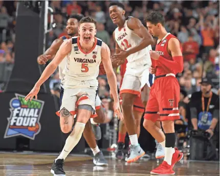  ?? ROBERT DEUTSCH/USA TODAY SPORTS ?? Virginia guard Kyle Guy gets the Cavaliers’ celebratio­n off to a running start Monday night after they defeated Texas Tech in overtime for the school’s first men’s basketball national title.