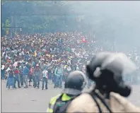  ?? AP PHOTO ?? Opponents of President Nicolas Maduro march in Caracas, Venezuela, Thursday, April 20, 2017. Tens of thousands of protesters flooded the streets again Thursday, one day after three people were killed and hundreds arrested in the biggest anti-government...