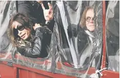  ??  ?? CONCERT CANCELLED: Aerosmith’s Steven Tyler (left ) and Tom Hamilton lean out the window of a duck boat as they depart for a performanc­e in Boston, Massachuse­tts Nov 5, 2012. — Reuters photo