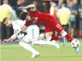  ?? — AP ?? Mohamed Salah ( right) sustained a shoulder injuryduri­ng the Champions League final on May 26.