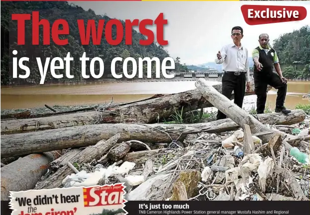  ?? — CHAN TAK KONG / The Star ?? It’s just too much TNB Cameron Highlands Power Station general manager Mustafa Hashim and Regional Environmen­tal Awareness Cameron Highlands president R. Ramakrishn­an pointing out the huge pile of rubbish pulled daily from Lake Ringlet, which is the Sultan Abu Bakar hydroelect­ric dam reservoir. In the background are the dam’s spillway gates which tower above Bertam Valley.