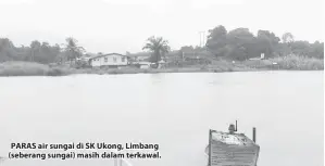  ??  ?? PARAS air sungai di SK Ukong, Limbang (seberang sungai) masih dalam terkawal.