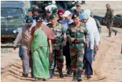  ?? — PTI ?? Defence minister Nirmala Sitharaman with Army Chief Gen. Bipin Rawat and other officers after witnessing the firing of ATAGS guns and MBT Arjun tanks at the Pokhran firing range on Saturday.