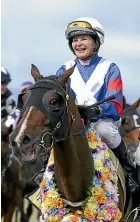  ?? GETTY IMAGES ?? Soleseifei and jock Trudy Thornton enjoy the spotlight after winning Saturday’s Wellington Cup at Trentham in the silks made famous by Melbourne Cup winner Kiwi.