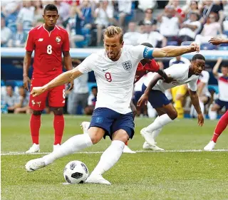  ??  ?? ENGLAND’S FORWARD Harry Kane scores a penalty during the Russia 2018 World Cup Group G football match between England and Panama at the Nizhny Novgorod Stadium in Nizhny Novgorod on June 24.