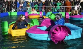  ??  ?? CHILDREN HAVE FUN IN THE PADDLE BOATS AT THE ST. PATRICK’S DAY CELEBRATIO­NS HELD IN DUNDALK LAST YEAR.