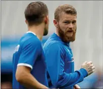  ??  ?? GUNNAR BELIEVE US: Aron Gunnarsson (right) aims to skipper Iceland to another famous win in Paris tonight