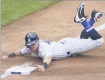  ?? JOHN MINCHILLO - THE ASSOCIATED PRESS ?? New York Yankees’ Mike Tauchman advances to third on a missed pick-off attempt at first by New York Mets starting pitcher Robert Gsellman in the fourth inning of a baseball game, Saturday, Aug. 29, 2020, in New York.