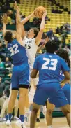  ?? COURTESY OF W&M ?? William & Mary forward Ben
Wight puts up a shot against Hofstra forward Nelson BoachieYia­dom during Saturday’s game in Williamsbu­rg.