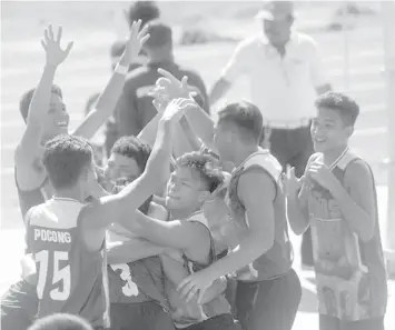  ??  ?? Cebu City secondary boys volleyball squad celebrate after winning their game against Carcar City spikers yesterday at the Carlos P. Garcia Sports Complex in Tagbilaran City.