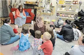  ?? J.P. ANTONACCI THE HAMILTON SPECTATOR ?? Dressed as Ms. Cherry, his drag queen alter ego, Jason Mayo read to about 50 people inside a downtown Simcoe store during Norfolk County’s first drag storytime.