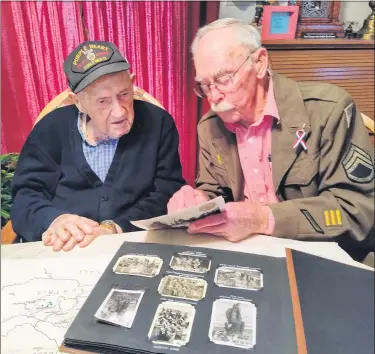  ?? RON DEVLIN — MEDIANEWS GROUP ?? World War II veterans, both 99years old, meet for the first time in Bern Township. Edward W. Mull, left, served in the 318th Infantry Regiment. Norman Reifsnyder served in the 319th. They live only miles apart, but it took 99years for them to meet in person.