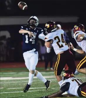  ?? Erik Trautmann / Hearst Connecticu­t Media ?? Staples QB Ryan Thompson attempts a pass against St. Joseph on Friday night in Westport.