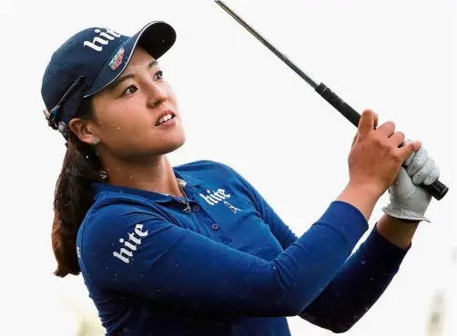  ??  ?? Focussed:
Chun In-gee follows the flight of her ball after playing on the 16th hole in the second round of the Evian Championsh­ip in Evian, France, on Friday. — AP