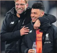  ??  ?? THAT’S MY BOY: Klopp and Oxlade-Chamberlai­n