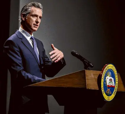  ?? Brontë Wittpenn/The Chronicle ?? Gov. Gavin Newsom announces his 2024-25 state budget proposal, including his plans to deal with a projected $68 billion deficit, in Secretary of State Auditorium in Sacramento on Jan. 10.